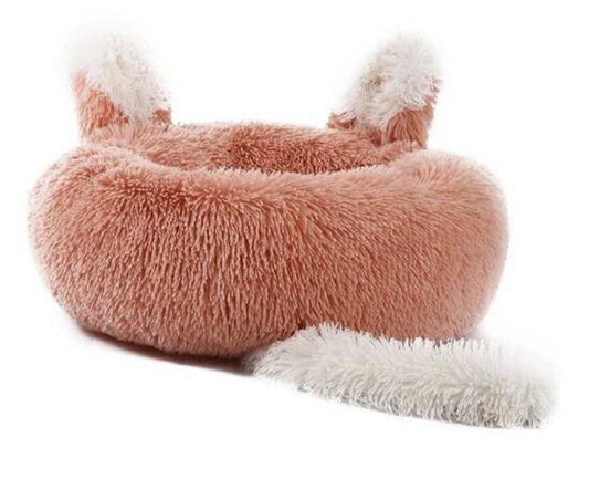 Small dog resting in faux fur donut bed with raised sides – Blessed Paws