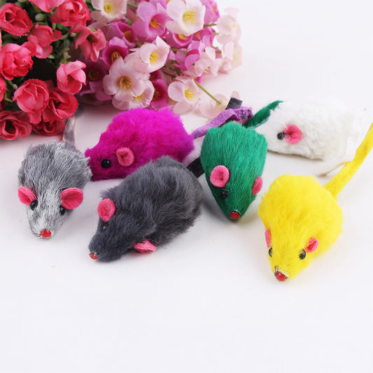 10 colorful plush mouse cat toys from Blessed Paws arranged with flowers